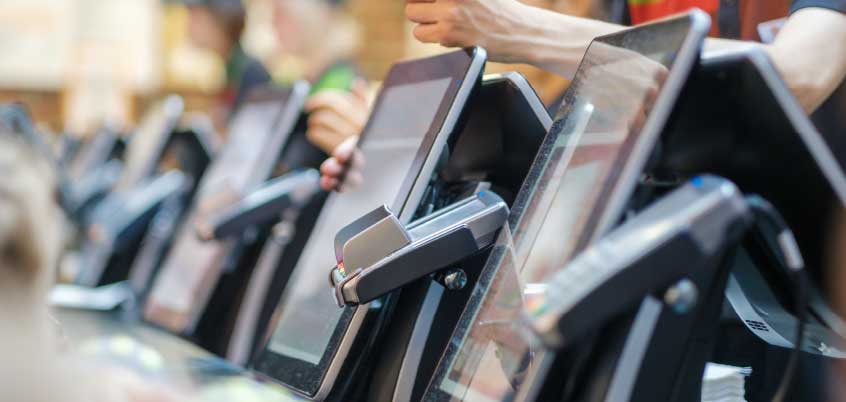 close-up of ordering screens at a quick service restaurant