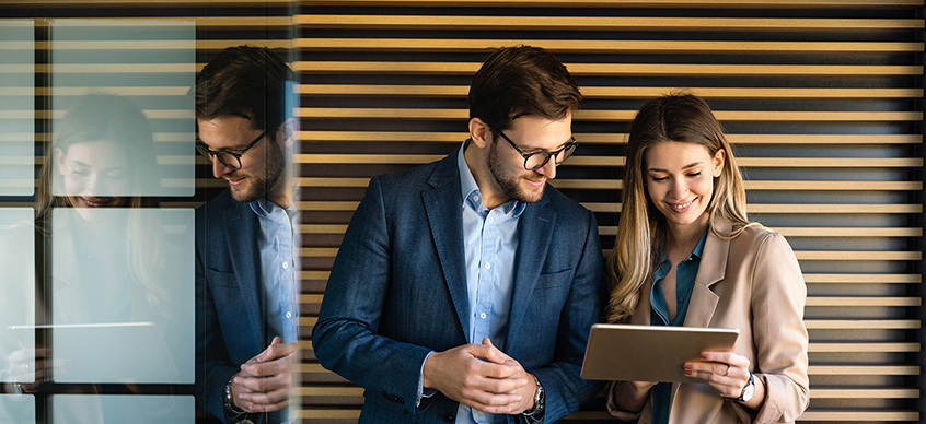 Man and woman looking at tablet