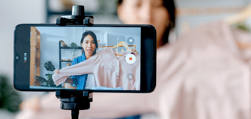 woman recording on smartphone