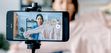 woman recording on smartphone