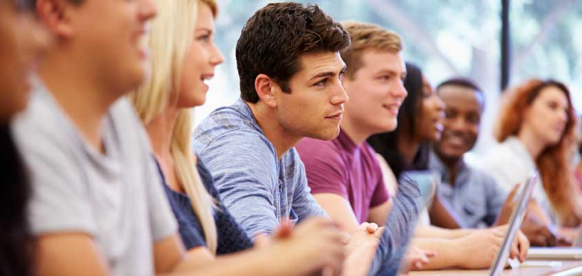 Students in a classroom with laptops