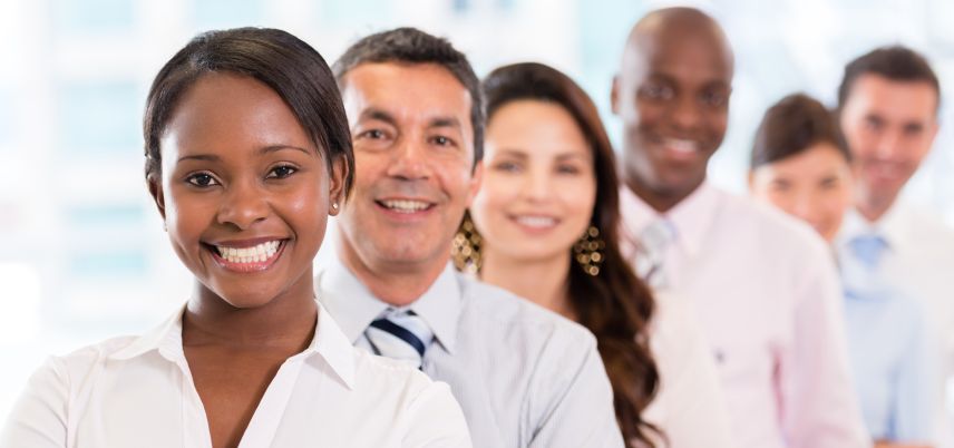 diverse group of people smiling at camera