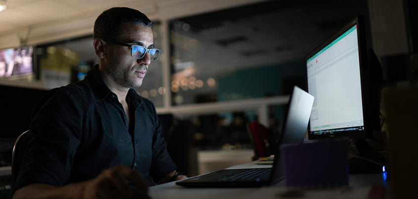 Man working on laptop.