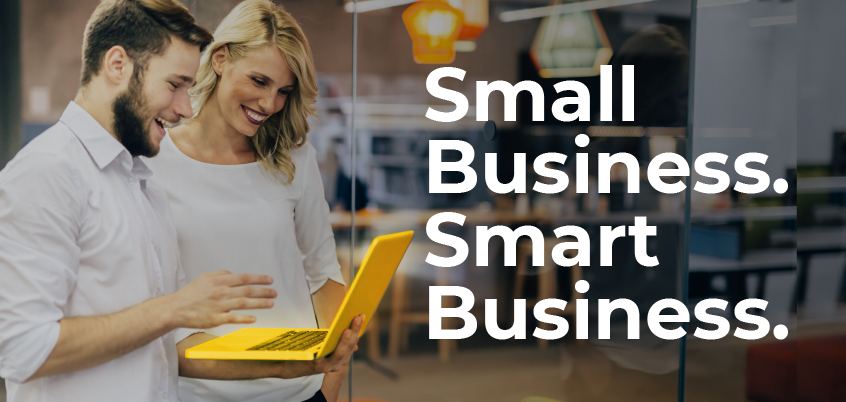 Man and woman on laptop next to Small Business. Smart Business. graphic.