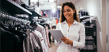 Woman in retail environment using tablet