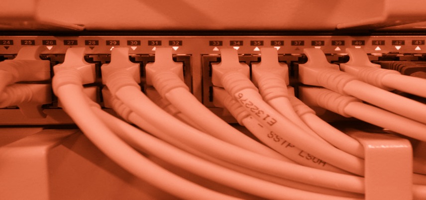 cables plugged into the wall, red tint