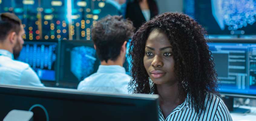 Woman looking at computer monitor
