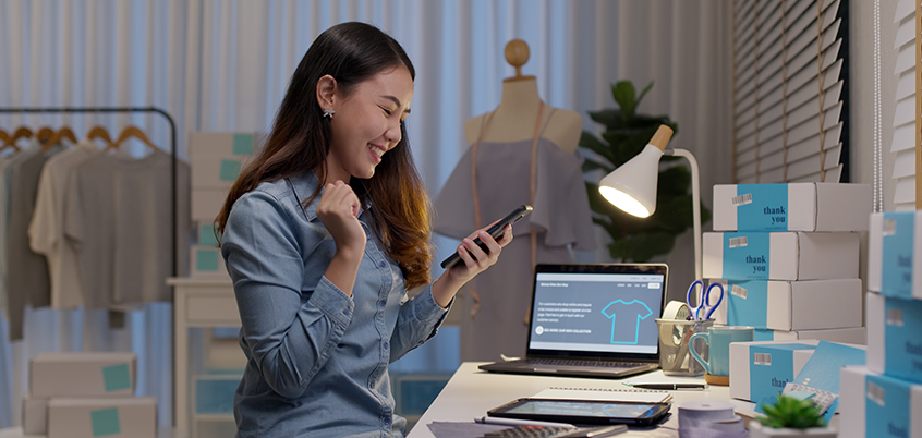 Woman happy looking at phone