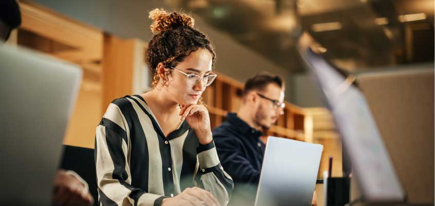 woman looking at laptop