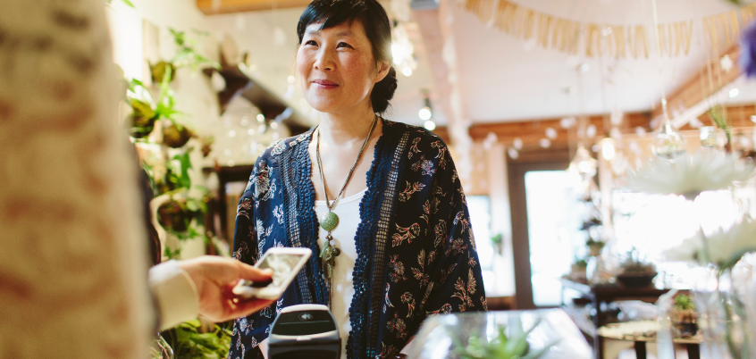Woman Handing Friend Phone
