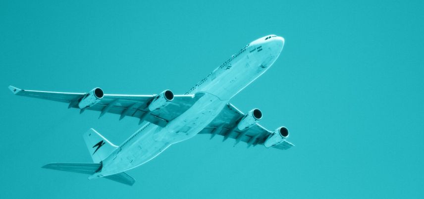 airplane taking of, blue-green tint