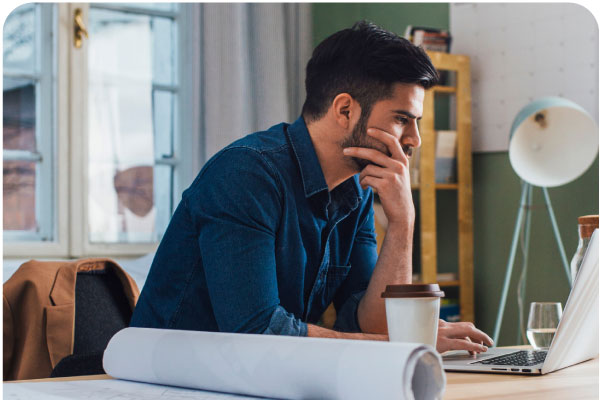 Man working on laptop at desk