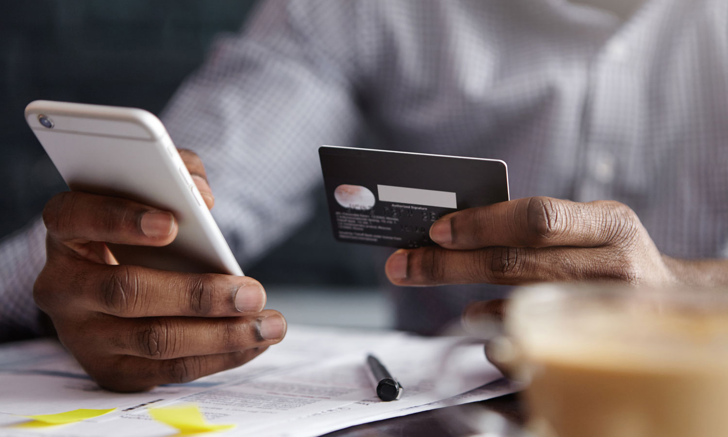 Person entering their credit card info on their phone
