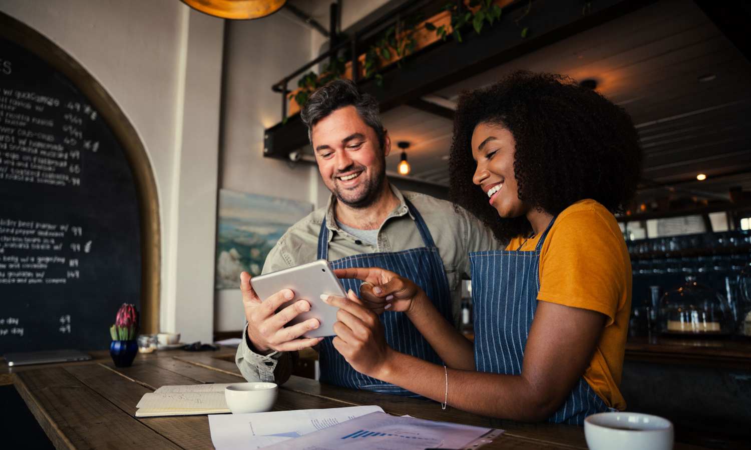 Couple reviewing recipe on mobile device