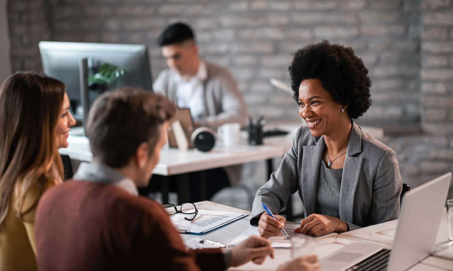 Couple reviewing their finances with financial planner