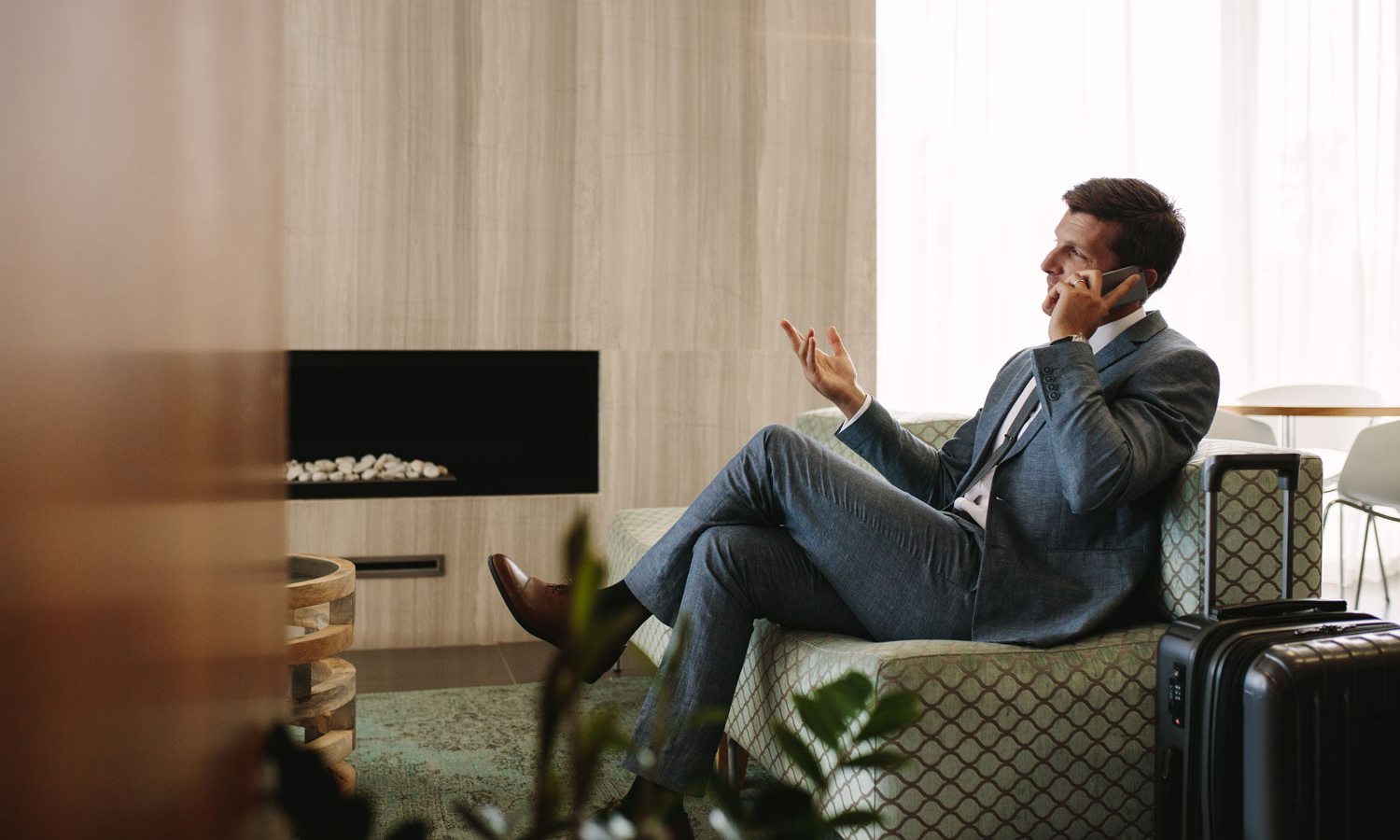 Man in suit talking on phone