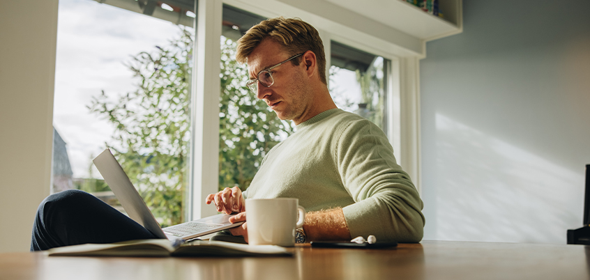 Man working on his laptop at home